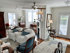 Living room also provides desk and chair in well lit alcove 