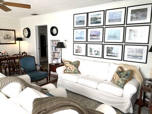 Living room showing cabinet with DVDs