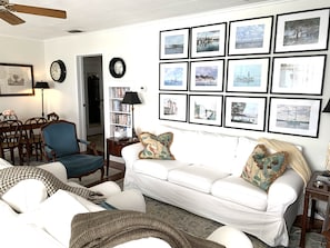 Living room showing cabinet with DVDs