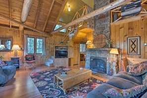 This spacious home boasts a warm cabin ambiance.