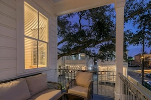 Balcony with sitting area at night