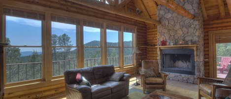 Main Living room with amazing views.  Insert now in fireplace with a hearth.