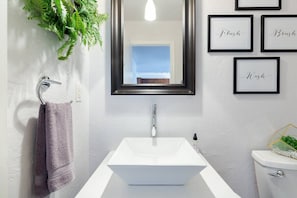 Unique bathroom remodel features porcelain vessel sink