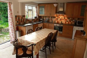 The modern kitchen/diner opens has French doors to the garden.