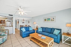 Spacious living room w/ sleeper sofa, loveseat, smart TV, & 2 accent chairs.