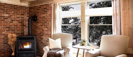 The smaller, more 'formal' living area adjoins the dining room.  Fireplace & TV