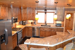 Fully equipped gourmet kitchen to prepare meals with family and friends. 