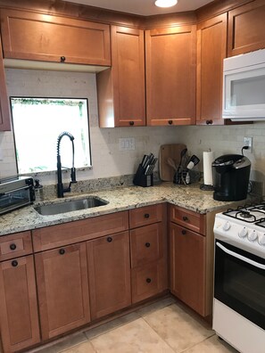 Newly remodeled with fully stocked kitchen and granite counters 