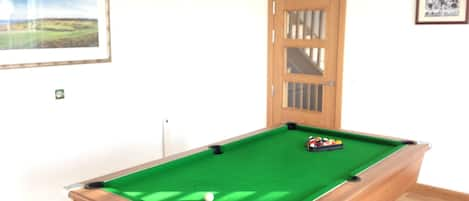 Watch tv or enjoy a game of pool in the games room