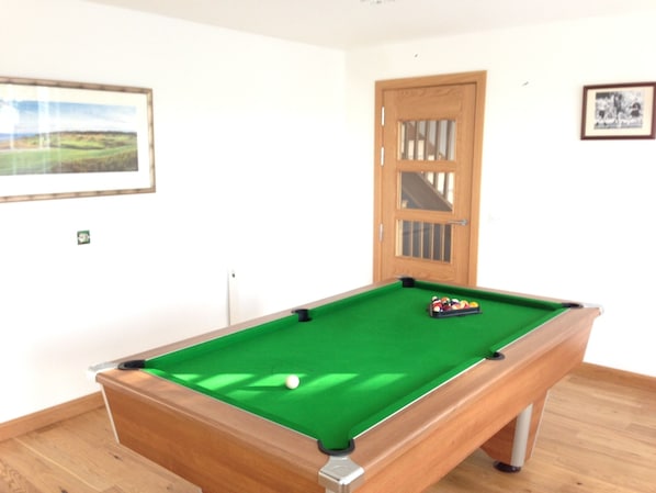 Watch tv or enjoy a game of pool in the games room