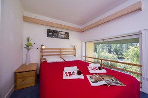Bedroom 1 with double bed and nice view of mountains