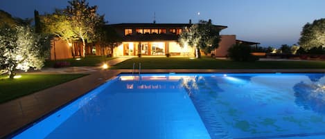 Villa front view at night.