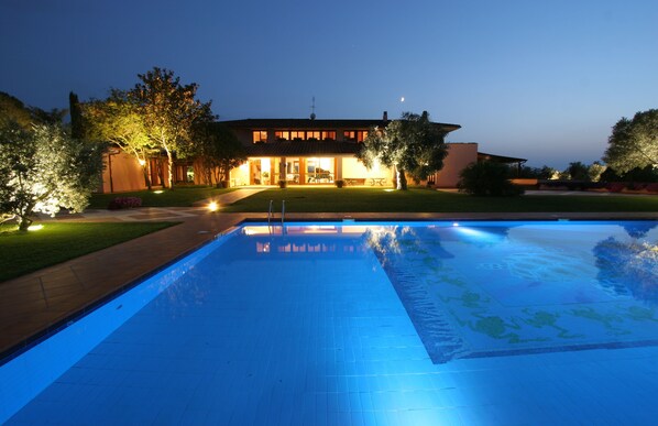 Villa front view at night.