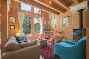 Cosy and modern living room with a log burner