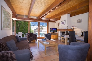 Spacious open plan living room with HDTV