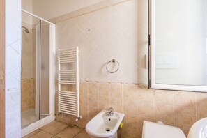Bathroom with shower and a toilet