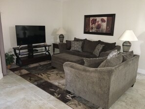 Sofa, love seat and 65" smart TV.