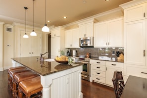 Stainless steel appliances, granite countertops and Subzero refrigerator
