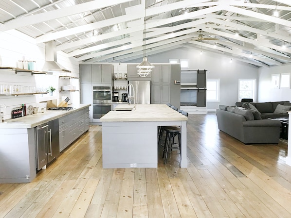 Open and contemporary gourmet kitchen and living space. 