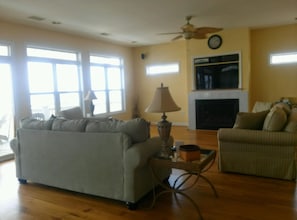 Living room with 55 inch HDTV that includes DVR and Blu-Ray