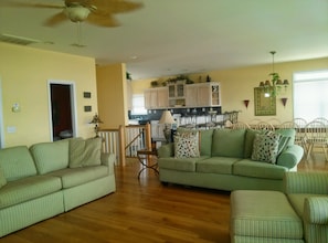 Living room looking into kitchen and dining room