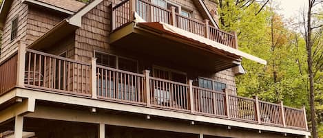 Front view of the expansive lower balcony and private master balcony.