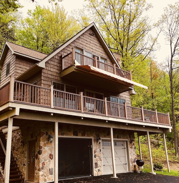 Front view of the expansive lower balcony and private master balcony.