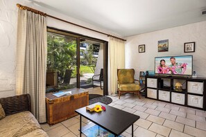 Living room with flatscreen tv and lanai acces
