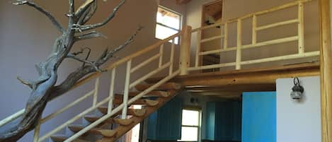 Stairs to the master bedroom , bath, deck