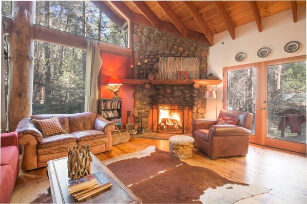 Huge windows reveal canyon walls and forest views in the spacious great room