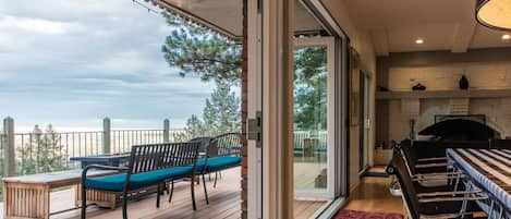 Dining room opens to large deck and city views