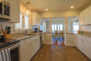 The kitchen connects to the dining areas.