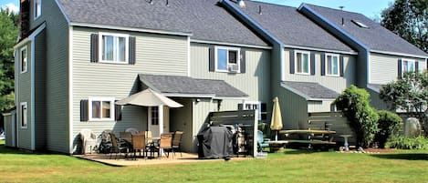 Stamped concrete patio seats 12, Grill, lawn games provided.