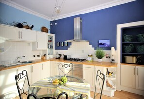 Fully equipped kitchen provides a bright elegant eating space 