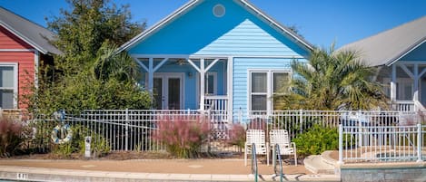 Back porch is right off the pool for a quick dip after a long day at the Beach!