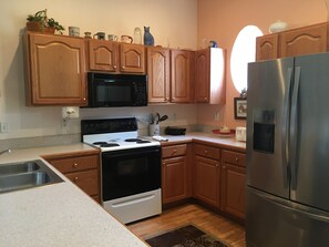 Full kitchen with all the comforts of home. Includes dishwasher.