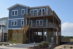 Two levels of wrap around porches maximize marsh and ocean views