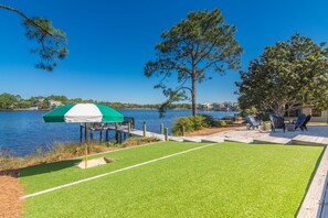 The grass is always green here.  Play on the lawn with a built in sandbox. 