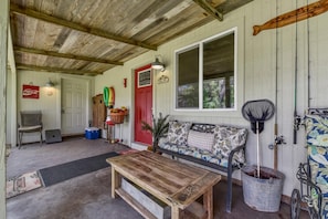 Covered front porch is shady and a great place to relax!