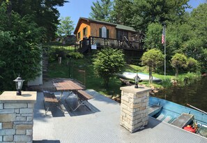 cottage as viewed from the water when standing on Alum dock. 10HP motor boat  rt