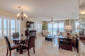 Living/dining areawith windows overlooking beach