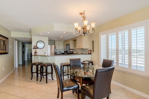 Seating for 9 in dining area.  4 at dining table and 5 barstools