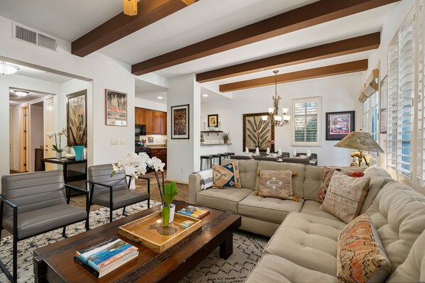 Open concept living room, dining area, kitchen and main entrance