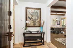 Welcoming Tahiti Suite Villa entryway with tropical decor and warm tile flooring