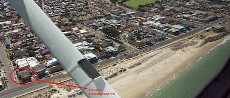 Absolute Beachfront apartment - front position. Beach access & shower out front