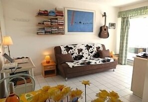 living room with large selection of dads for your pleasure. Guitar etc
