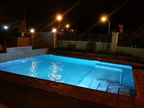 Illuminated pool. Beautiful and romantic nights by the pool