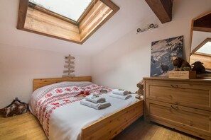 Family bedroom with double bed and bunk beds