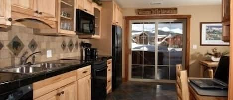 Beautiful, full modern 
kitchen opens up onto the patio and hot tub area