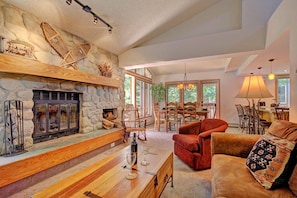 Living room with wood burning fireplace - Living area features wood burning fireplace. 